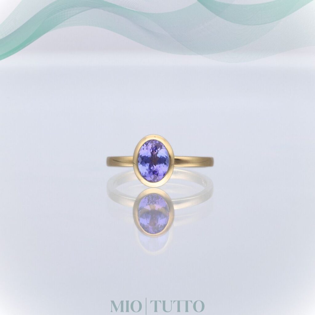 Rub over modern yellow gold Tanzanite ring